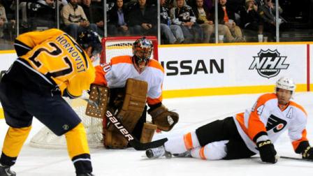 Philadelphia Flyers center Claude Giroux (28) brings the puck down ice ahead of Nashville Predators forward Brian McGrattan (23) in the first period of an NHL hockey game on Saturday, Jan. 14, 2012, in Nashville, Tenn. (AP Photo/Mike Strasinger)