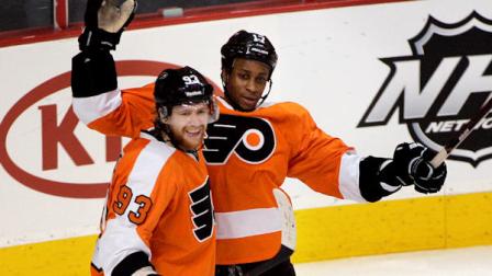 Philadelphia Flyers Jakub Voracek, left, and Wayne Simmonds await teammates as they celebrate Simmonds power-play goal during the third period of an NHL hockey game against the Nashville Predators, Thursday, Feb. 2, 2012, in Philadelphia. It was Simmonds second goal of the game. The Flyers won 4-1. (AP Photo/Tom Mihalek)