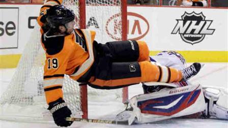 Philadelphia Flyers Scott Hartnell, left, collides with New York Rangers Henrik Lundqvist, of Sweden, in the second period of an NHL hockey game, Saturday, Feb. 11, 2012, in Philadelphia. Hartnell was given a penalty for goaltender interference on the play. (AP Photo/Matt Slocum)