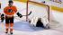 Philadelphia Flyers Matt Carle, left, looks away...