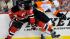 New Jersey Devils Bryce Salvadore, left, battles...