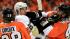 Philadelphia Flyers Claude Giroux, left, holds...