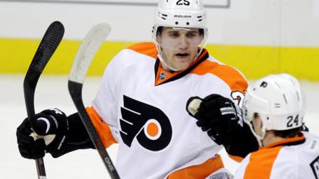 Philadelphia Flyers Matt Carle (25) celebrates his first-period goal with Matt Read (24) against the Pittsburgh Penguins during Game 5 of an opening-round NHL Stanley Cup hockey playoff series in Pittsburgh Friday, April 20, 2012. (AP Photo/Gene J. Puskar)