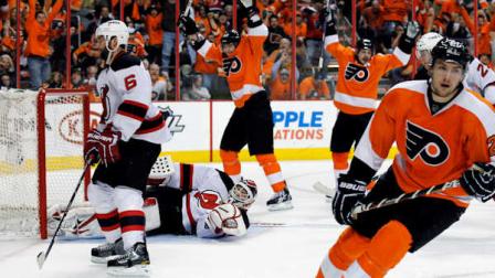 Philadelphia Flyers left wing James van Riemsdyk, right, skates away after scoring a goal as New Jersey Devils defenseman Andy Greene, left, reacts in the second period of Game 1 in a second-round NHL Stanley Cup hockey playoff series, Sunday, April 29, 2012, in Philadelphia. The Flyers won 4-3 in overtime. (AP Photo/Alex Brandon)