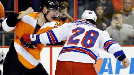 Philadelphia Flyers Tye McGinn, left, and New York Rangers Kris Newbury fight during the second period of an NHL hockey game, Thursday, Jan. 24, 2013, in Philadelphia. (AP Photo/Matt Slocum)