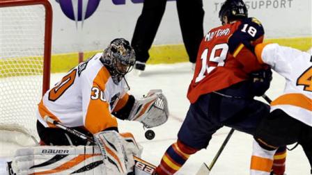 Philadelphia Flyers goalie Ilya Bryzgalov (30) blocks a shot by Florida Panthers Shawn Matthias (18) during the first period of an NHL hockey game in Sunrise, Fla., Saturday, Jan. 26, 2013. (AP Photo/Alan Diaz)
