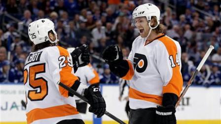 Philadelphia Flyers center Sean Couturier (14) celebrates with center Maxime Talbot (25) after scoring against the Tampa Bay Lightning during the first period of an NHL hockey game Sunday, Jan. 27, 2013, in Tampa, Fla. (AP Photo/Chris OMeara)