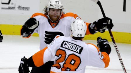 Philadelphia Flyers right wing Jakub Voracek (93) celebrates with Philadelphia Flyers center Claude Giroux (28) after scoring the game-winning goal late in the third period of an NHL hockey game against the Pittsburgh Penguins in Pittsburgh Wednesday, Feb. 20, 2013. the Flyers won 6-5. (AP Photo/Gene J. Puskar)