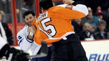 Toronto Maple Leafs Mike Brown, left, and Philadelphia Flyers Tye McGinn fight in the first period of an NHL hockey game, Monday, Feb 25, 2013, in Philadelphia. (AP Photo/Michael Perez)