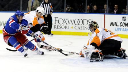 Philadelphia Flyers goalie Ilya Bryzgalov (30), of Russia, stops a shot on the goal by New York Rangers Carl Hagelin (62), of Sweden, as teammate Bruno Gervais (27) defends during the second period of an NHL hockey game Tuesday, March 5, 2013, in New York. (AP Photo/Frank Franklin II)