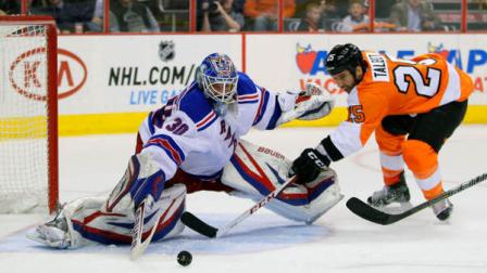 Philadelphia Flyers Max Talbot shoots against New York Rangers Henrik Lundqvist, left, in the second period of an NHL hockey game, Tuesday, March 26, 2013, in Philadelphia. (AP Photo/Tom Mihalek)