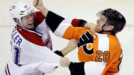Philadelphia Flyers Claude Giroux (28) and Montreal Canadiens Lars Eller (81), of Denmark, fight during the third period of an NHL hockey game, Wednesday, April 3, 2013, in Philadelphia. Philadelphia won 5-3. (AP Photo/Matt Slocum)