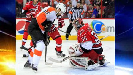 Philadelphia Flyers Simon Gagne (12) has his shot blocked by Carolina Hurricanes goalie Justin Peters (35) during the first period of an NHL hockey game, Saturday, April 20, 2013, in Raleigh, N.C. (AP Photo/Karl B DeBlaker)