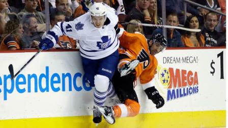 Toronto Maple Leafs Nikolai Kulemin, left, of Russia, collides with Philadelphia Flyers Max Talbot during the first period of an NHL hockey game on Wednesday, Oct. 2, 2013, in Philadelphia, Pa. (AP Photo/Matt Slocum)