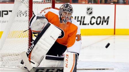 Philadelphia Flyers goalie Steve Mason eyes a shot on-goal in the first period of an NHL hockey game against the Phoenix Coyotes, Friday, Oct. 11, 2013, in Philadelphia. (AP Photo/Tom Mihalek)