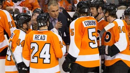 Philadelphia Flyers Craig Berube talks things over with his team during the third period of an NHL hockey game against the Winnipeg Jets, Friday, Nov. 29, 2013, in Philadelphia. The Flyers win 2-1. (AP Photo/Chris Szagola)