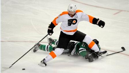 Philadelphia Flyers left wing Scott Hartnell (19) goes after the puck over Dallas Stars left wing Antoine Roussel (21) in the third period during an NHL hockey game, Saturday, Dec. 7, 2013 in Dallas. Dallas Stars won 5-1. (AP Photo/Matt Strasen)