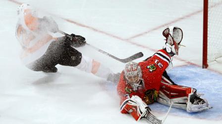 Chicago Blackhawks goalie Antti Raanta (31) makes a save on a breakaway, short-handed shot by Philadelphia Flyers left wing Michael Raffl during the third period of an NHL hockey game on Wednesday, Dec. 11, 2013, in Chicago. The Blackhawks won 7-2. (AP Photo/Charles Rex Arbogast)