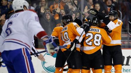 Philadelphia Flyers Claude Giroux (28) celebrates with teammates after scoring during the second period of an NHL hockey game against the Montreal Canadiens, Thursday, Dec. 12, 2013, in Philadelphia. (AP Photo/Matt Slocum)