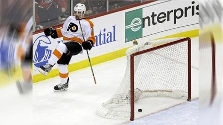 Philadelphia Flyers center Brayden Schenn celebrates after scoring against the New Jersey Devils during overtime in an NHL hockey game, Tuesday, Jan. 7, 2014, in Newark, N.J. The Flyers won 3-2. (AP Photo/Julio Cortez)