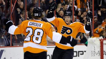 Philadelphia Flyers Michael Raffl, right, of Austria, celebrates with Claude Giroux after Raffl scored during the second period of an NHL hockey game against the Montreal Canadiens, Wednesday, Jan. 8, 2014, in Philadelphia. (AP Photo/Matt Slocum)