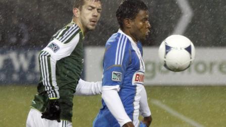 Philadelphia Union forward Lionard Pajoy, right, and Portland Timbers defender Eric Brunner battle chase after the ball during the first half of their MLS soccer game in Portland, Ore., Monday, March 12, 2012.(AP Photo/Don Ryan)
