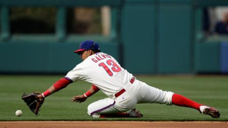 Philadelphia Phillies second baseman Freddy Galvis cannot reach a single by New York Mets Jason Bay in the second inning of a baseball game on Saturday, April 14, 2012, in Philadelphia. (AP Photo/Matt Slocum)