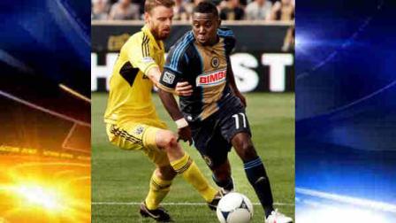 Columbus Crews Eddie Gaven, left, reaches around Philadelphia Unions Freddy Adu as they chase the ball during the second half of an MLS soccer match, Saturday, April 14, 2012, in Chester, Pa. The Union won 1-0. (AP Photo/Tom Mihalek)