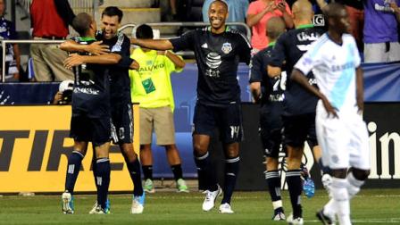 MLS All-Stars Chris Wondolowski, center, of the San Jose Earthquakes, celebrates with Justin Marrow (15), also of the Earthquakes, and Thierry Henry (14), of the New York Red Bulls, after scoring against Chelsea FC during the first half of soccers MLS All-Star game, Wednesday, July 25, 2012, in Chester, Pa. (AP Photo/Michael Perez)