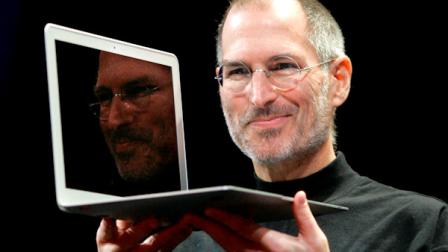 FILE - In this Jan. 15, 2008, file photo, Apple CEO Steve Jobs holds up the new MacBook Air after giving the keynote address at the Apple MacWorld Conference in San Francisco. Apple on Wednesday, Oct. 5, 2011 said Jobs has died. He was 56. (AP Photo/Jeff Chiu, File)