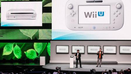 Shigeru Miyamoto, senior manager director of Nintendo Co., Ltd., left, with Bill Trinen, director of product marketing of Treehouse, introduce the Wii U at the Nintendo All-Access presentation at the E3 2012 in Los Angeles Tuesday, June 5, 2012. The Electronic Entertainment Expo runs from June 5-7 in Los Angeles. (AP Photo/Damian Dovarganes)