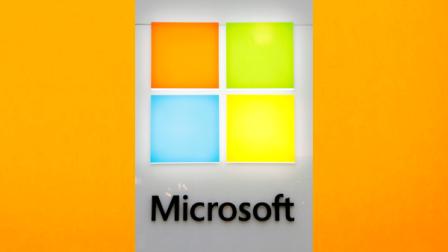 A new Microsoft logo is seen on a wall of a newly opened Microsoft store in Boston, Thursday, Aug. 23, 2012. The new logo marks the first time that Microsoft Corp. has revamped its logo in 25 years. (AP Photo/Steven Senne)