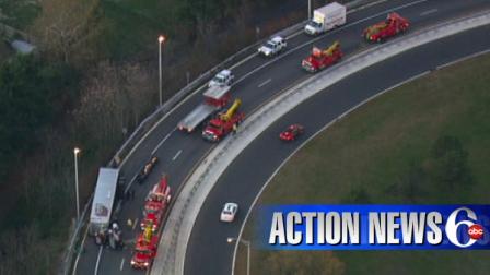 The view from Chopper 6 HD shows 5 heavy-duty tow trucks pulling up to the scene after a tractor trailer flipped on the eastbound ramp of Route 90, heading to Route 130 northbound in Pennsauken, New Jersey on Wednesday morning.