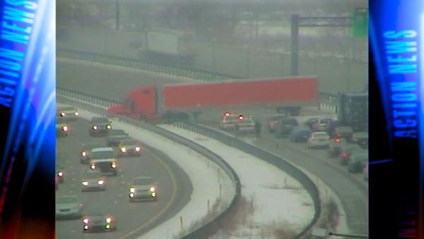 Traffic is jammed on the I-95 inner lanes near the Philadelphia International Airport because of a tractor trailer that ended up straddling the highway. Drivers are being forced onto the outer lanes.