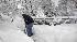Man shovels snow in McLean,VA. (AP Photo)