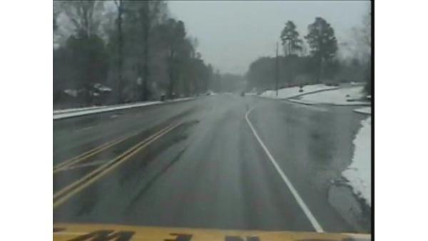 Pictures from Breaking News One show wet streets and snow on the ground during the Thursday morning commute.