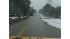 Pictures from Breaking News One show wet streets...