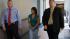 Helen Reyes is escorted by two officers Thursday, July 29.