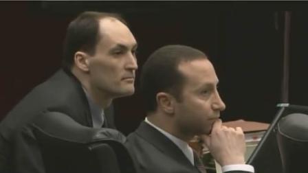 Brad Cooper listens to evidence with his attorney Howard Kurtz