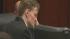 Jason Young listens to testimony in a Wake...