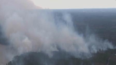 Smoke rises from a brush fire in 2012.