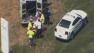 Emergency workers help a wounded person at Noble Oil Services on Clyde Rhyne Drive in Sanford.