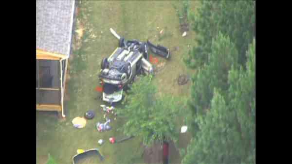 Part of Davis Drive in Cary had to be closed Thursday after a vehicle ran off the road and landed upside down in a backyard