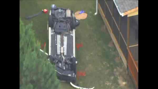 Part of Davis Drive in Cary had to be closed Thursday after a vehicle ran off the road and landed upside down in a backyard