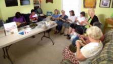 Members of the Daughters of American Revolution knit hats for the troops.