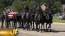 DeMuths flag-draped coffin was wheeled to the church on a horse-drawn caisson as fellow officers stood to attention