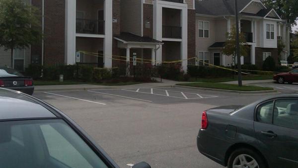 Crime tape up in front of a building at the Abberly Place Apartment Homes in the 500 block of Abberly Crest Boulevard.