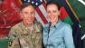 This July 13, 2011, photo made available on the International Security Assistance Forces Flickr website shows Gen. Davis Petraeus, left, shaking hands with Paula Broadwell