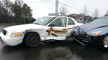 The sheriffs cruiser collided with another car at Page Road and T.W. Alexander Drive.