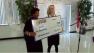 ABC11 General Manager Caroline Welch presents UNCF with a check for $5,000